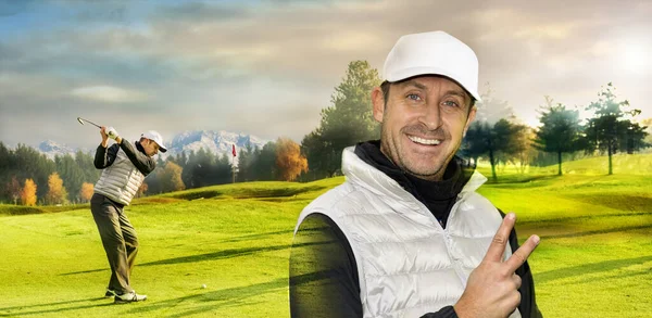 Close up portrait of gritty golf player biting his golf-club. Golf course with golf player in the background.