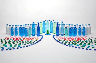 Plastic bottles, plastic caps. Plastic city concept. Plastic free concept. clipart