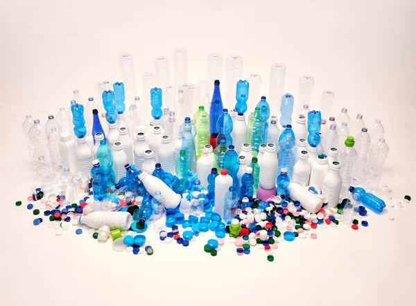 Plastic bottles, plastic caps. Plastic recycling concept. Plastic-free concept.