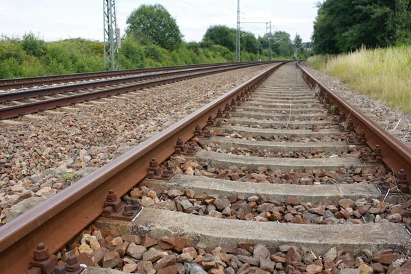 Iron rusty train railway detail dark stones — Stock Photo, Image