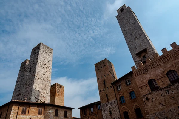 Towers and cloudy sky at San Gimignano — Stock Photo, Image