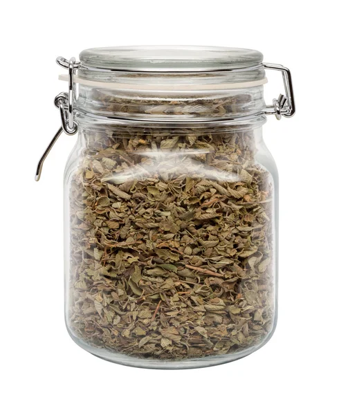 Dried Oregano Leaves in a Glass Canister — Stock Photo, Image