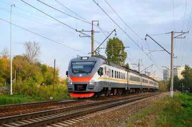 DC electric multiple units train EP2D-0067 follows on Pavshino - Nakhabino stretch of Moscow Railway, Krasnogorsk, Moscow region, Russian Federation, September 26, 2020
