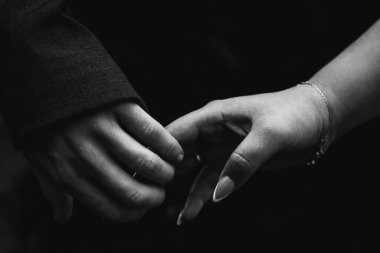 Close-up hand contact. The concept of meetings and breakups. Romance.