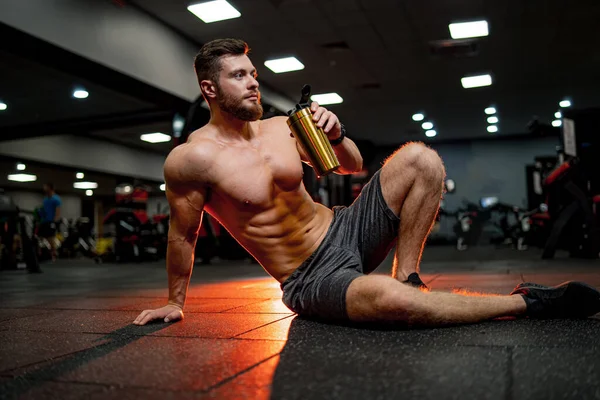 Very Muscular Sporty Guy Drinking Protein Warm Orange Background Naked — Stock Photo, Image