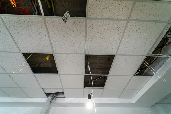 Empty industrial facility with ceiling under construction. Closeup.