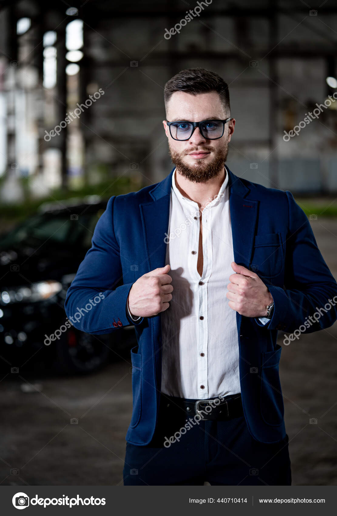 Elegant handsome man in classical suit poses near wooden fence - Stock  Image - Everypixel