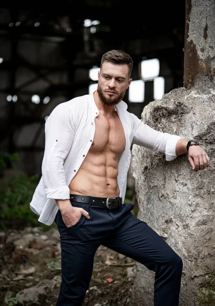 Handsome Man Standing Unbuttoned White Shirt Broken Concrete Wall Abandoned — Stock Photo, Image