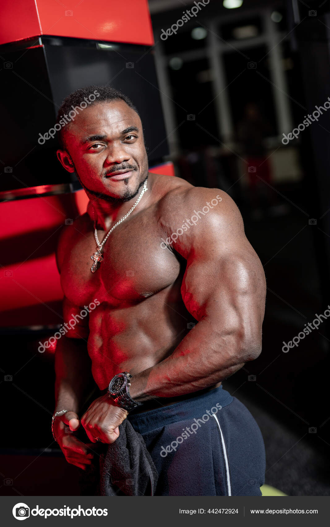 Portrait Of A Young Man Posing Bodybuilding Poses In Modern Fitness Center  Stock Photo, Picture and Royalty Free Image. Image 93606832.