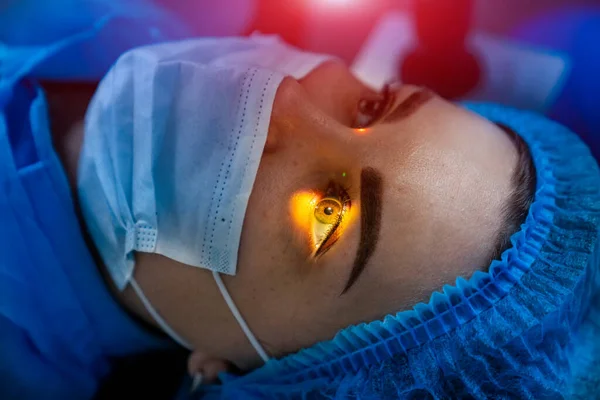 Laser woman eye correction. Operation with laser vision correction.