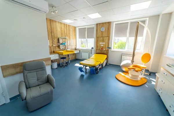 Modern light ward of maternity hospital. Empty patient beds in a maternity ward.