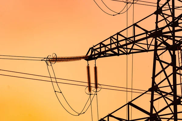 Energy technologies tower shadows. Dark silhouette of electric wire construction.