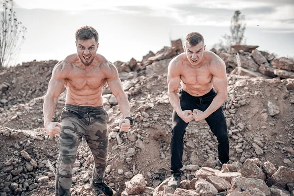 Two Strong Men Pumping Muscles Training Heavy Stones Rocky Background — Stock Photo, Image