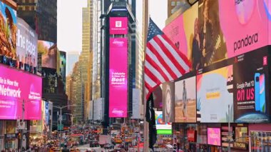 New York, USA, 1 August 2025: Billboards, screens and flags in New York, USA. Aerial view on Times Square filled with people and cars.
