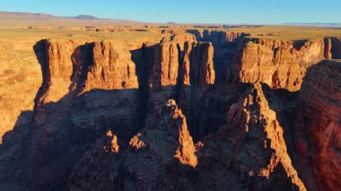 Spectacular deep canyon in the bright sun. Rising above Marble Canyon, Arizona, USA. Vast desert at backdrop.