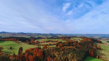 Hills and villages in autumn. Colorful Bavarian countryside with fields, hills and scattered villages.