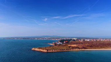 Sea coast surrounded by the blue waterscape. Scenery of the city located on the shore of the Black Sea in Bulgaria.