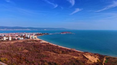 Scenery of the city at the coast of the Black Sea. Nessebar, Bulgaria with hazy mountains at backdrop.