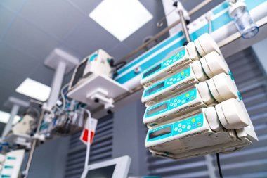 ICU beds with monitors. Modern intensive care room with equipped patient beds and devices