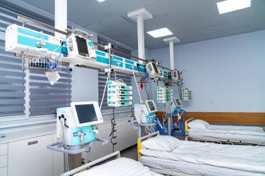 ICU beds panorama. Wide view of intensive care unit with beds and monitoring equipment