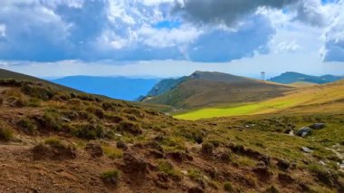 Rugged rocky cliffs of the Bucegi Mountains. The geological formations rise sharply against the sky.