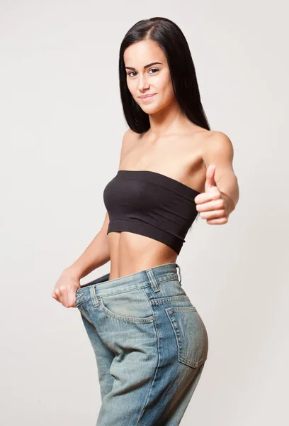 Slim young brunette with fit body. — Stock Photo, Image