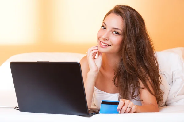 Gorgeous brunette using laptop. — Stock Photo, Image