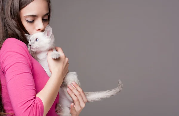 Brunette beauty with cute kitten.