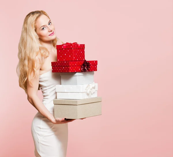 Young blond woman with gift boxes. — Stock Photo, Image