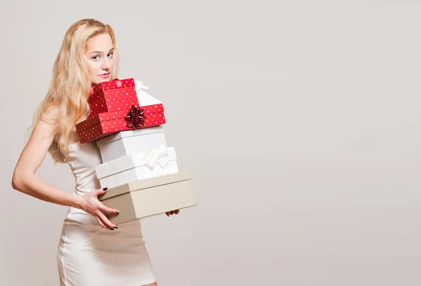 Young blond woman with gift boxes. — Stock Photo, Image