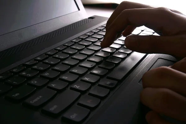 Hand typing on a computer keyboard — Stock Photo, Image