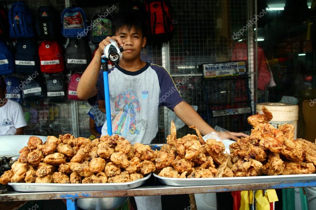 Street vendor selling fried chicken in antipolo city, philippines