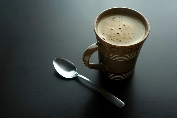 Koffie op een houten tafel — Stockfoto