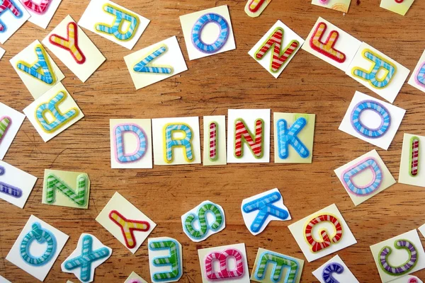 Colorful letters spelled as drink — Stock Photo, Image