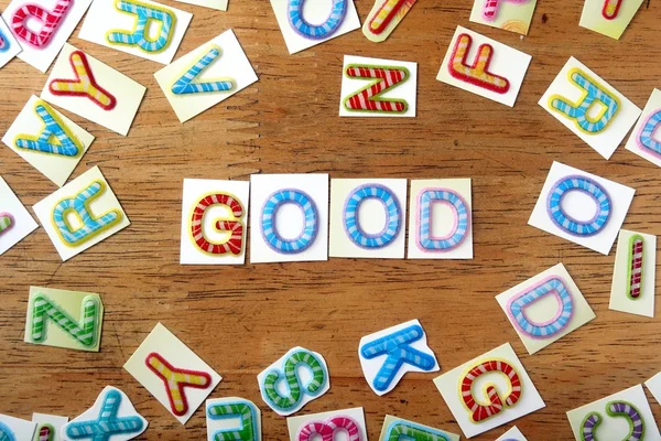 Colorful letters spelled as good — Stock Photo, Image