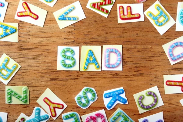 Colorful letters spelled as sad — Stock Photo, Image