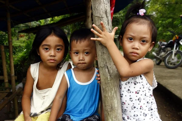 Young girls and boy looking at the camera — Stock Photo, Image