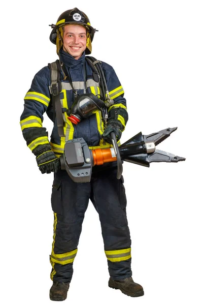 Uśmiechnięty młodzieniec w mundurze strażaka z bezprzewodowym połączonym narzędziem — Zdjęcie stockowe
