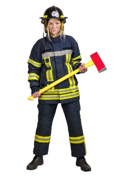 Young woman in uniform of firefighter with axe in hands — Stock Photo, Image