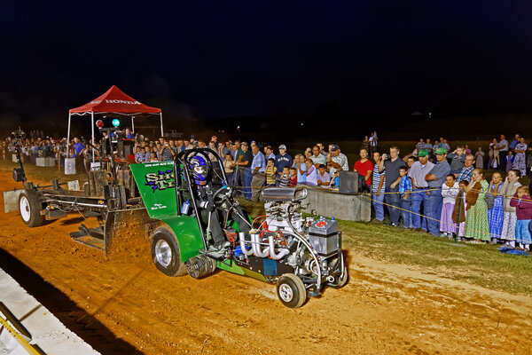 Man Driving Tractor at Pulling Competition