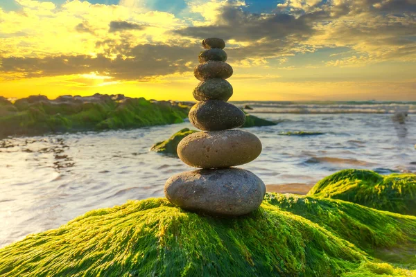 stock image Stacked Pebbles art on mossy rocks welcomes beautiful new day