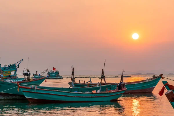 Sunset on the beautiful bay when the fishing boat faces the sun is also the end of the day at Ha Tien, Vietnam