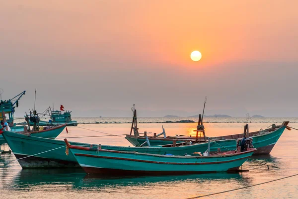 Sunset on the beautiful bay when the fishing boat faces the sun is also the end of the day at Ha Tien, Vietnam