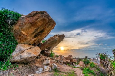 Abstract rocky beach with sunrise to greet the new day in the beautiful sea