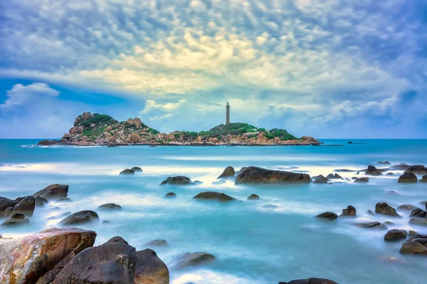 Ke Ga Lighthouse with surf patted smoother reefs create clouds on the sea as this is the only ancient lighthouse is located on the island in Vietnam