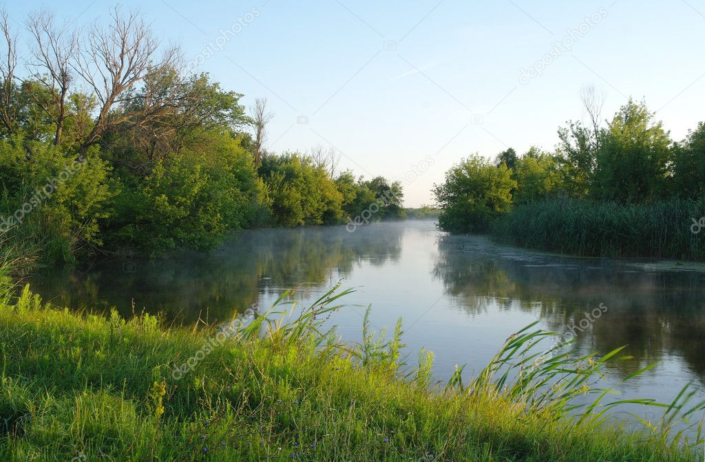 Morning landscape with fog on the river