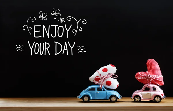 Enjoy Your Day message with pink and blue cars — Stock Photo, Image