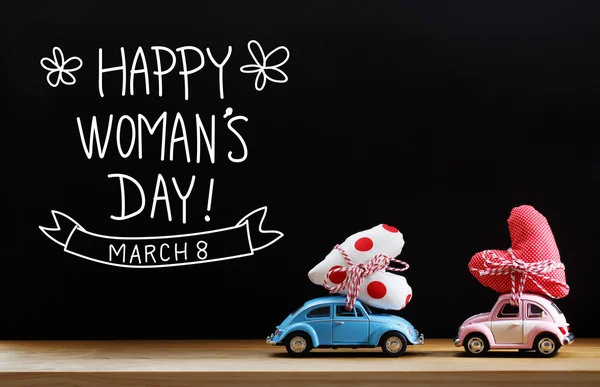 Womans Day bericht met roze en blauwe auto 's — Stockfoto