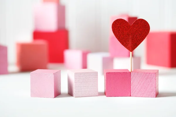 Wooden blocks with small heart — Stock Photo, Image