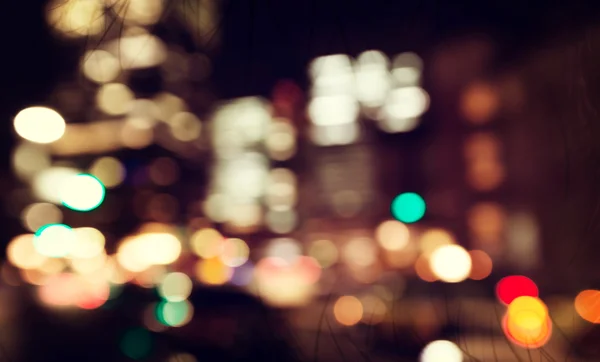 Escena de fondo de la ciudad desenfocada por la noche —  Fotos de Stock